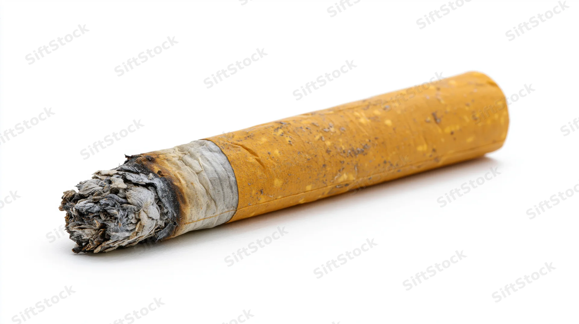 Cigarette butt with ash and filter lying horizontally on white background