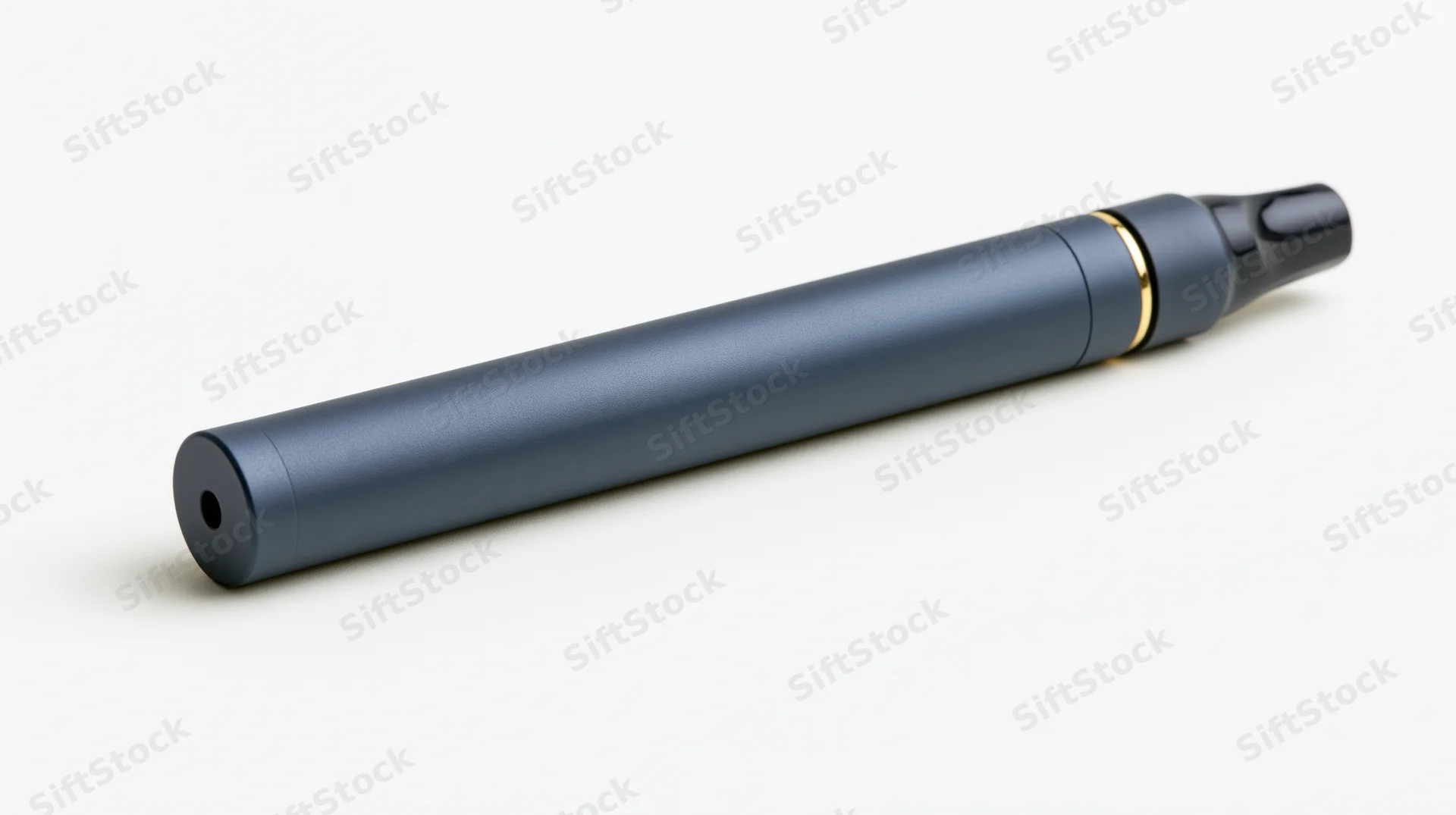 Matte dark grey-blue cylindrical vape pen device lying on white background