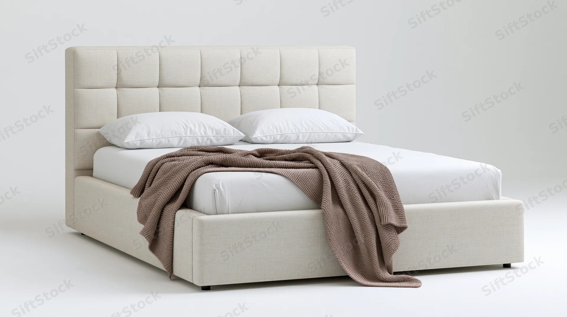 Modern upholstered queen bed with tufted grid-pattern headboard and white bedding on plain background
