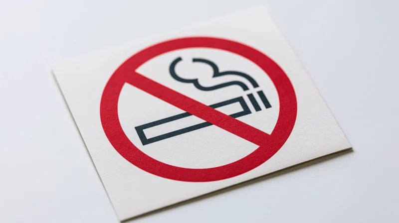 No-smoking prohibition sign printed on white paper flat graphic with red circle and slash symbol
