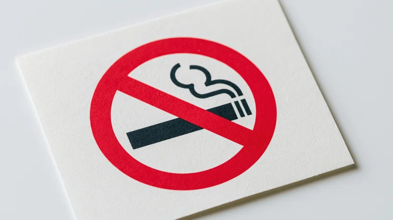 No-smoking prohibition sign printed on white paper flat against light background