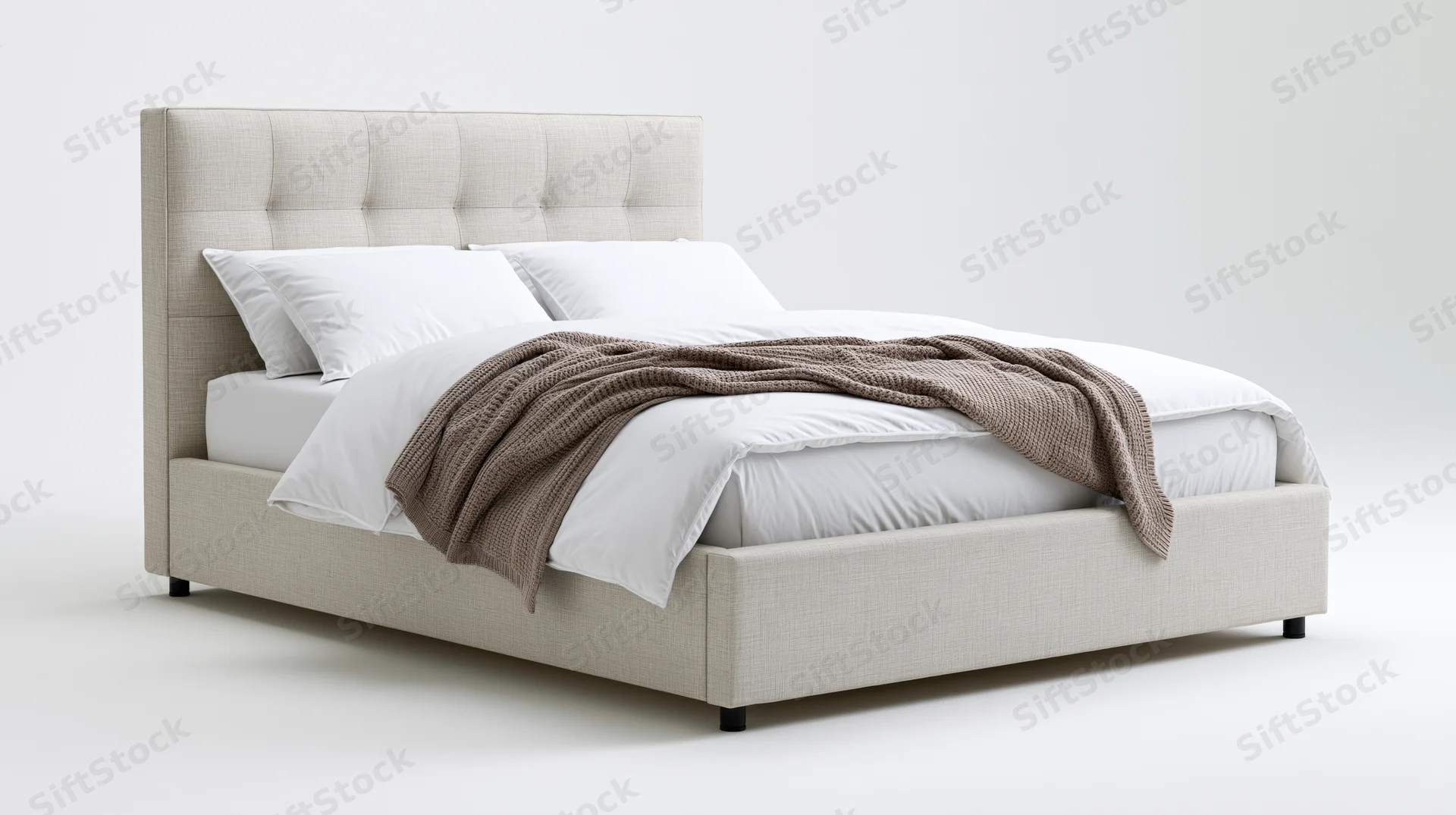 Queen-sized upholstered bed with tall tufted headboard and white bedding on plain white background