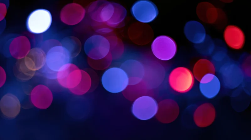 Abstract bokeh background with out-of-focus colored light orbs