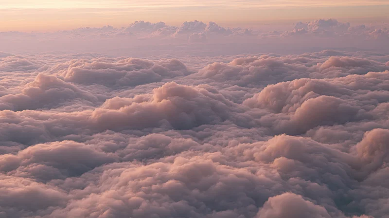 Aerial view of billowing cumulus clouds at sunset