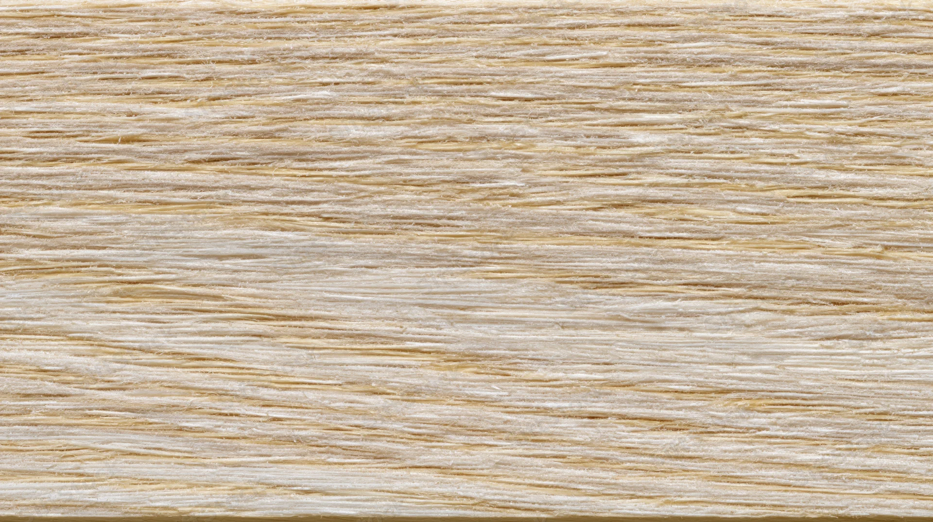 Close-up of pale ash wood surface showing fine horizontal grain pattern