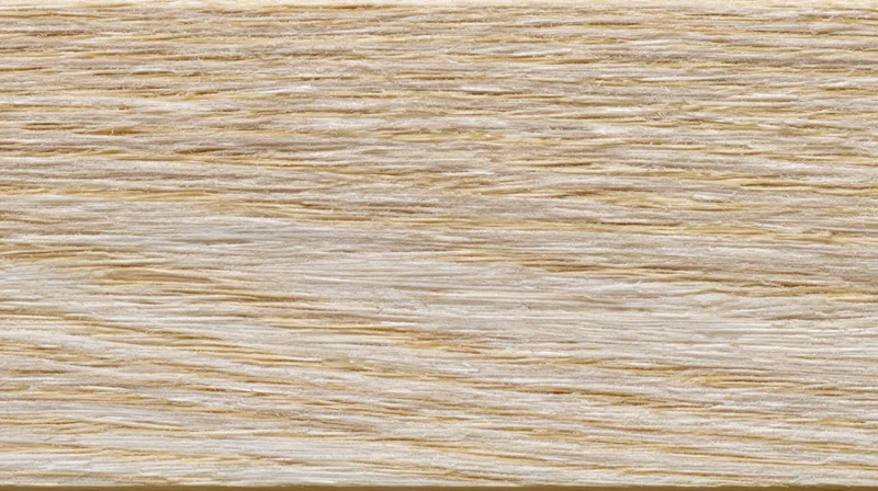 Close-up of pale ash wood surface showing fine horizontal grain pattern