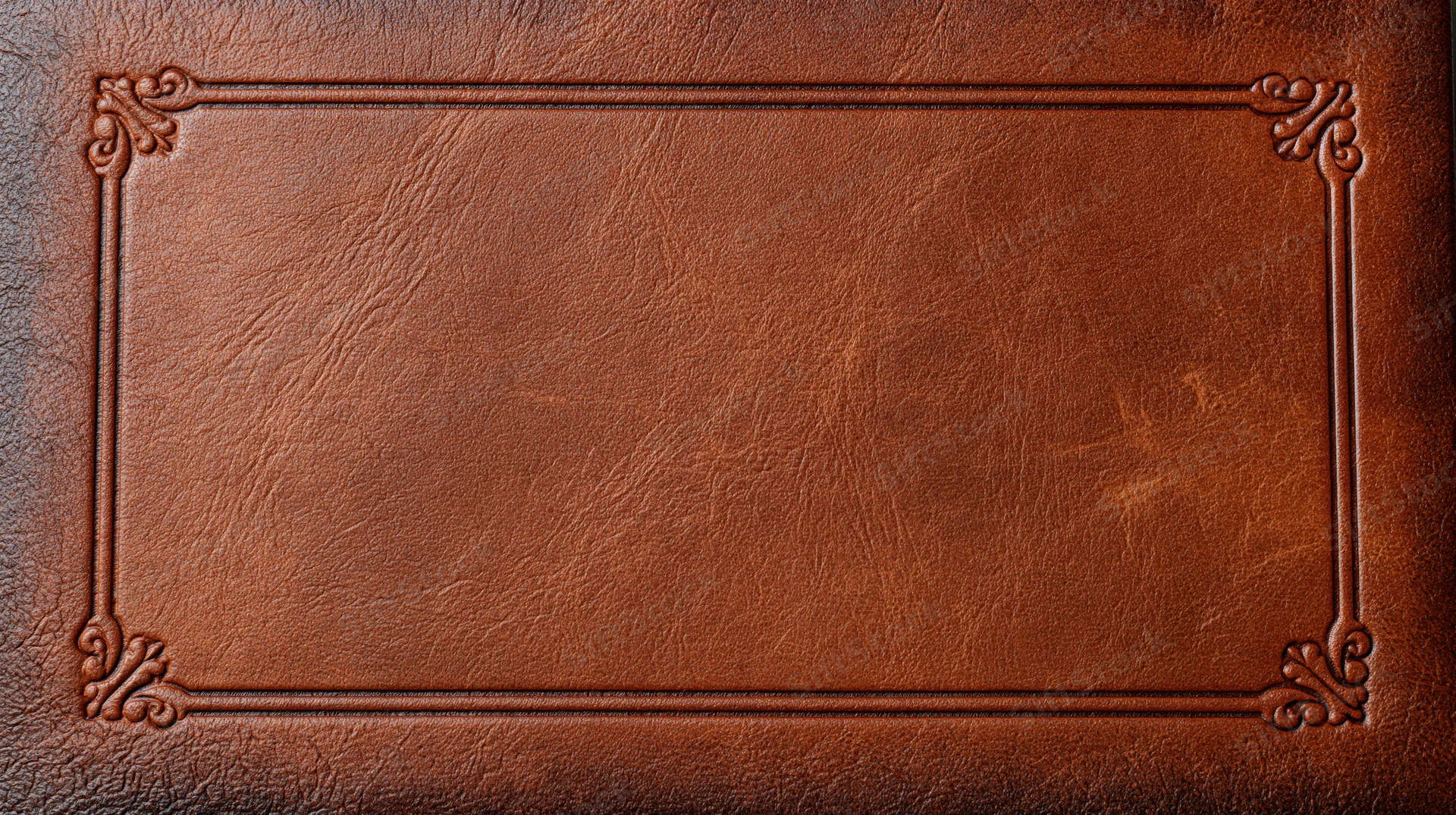 Embossed leather surface with ornate frame and copyspace for text or design
