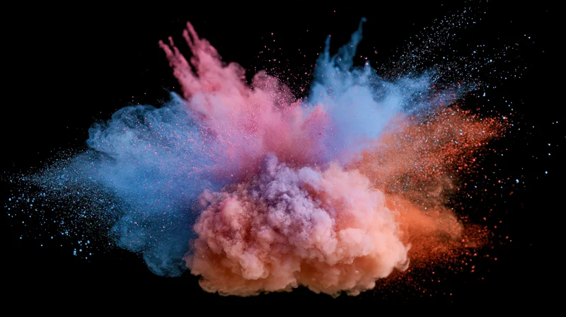 Colored powder exploding mid-burst against black background