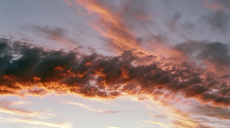 Dramatic cloud formation at sunset stretching across the sky