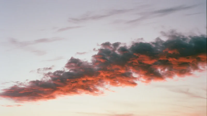 Dramatic cloud formation at sunset stretching across the sky