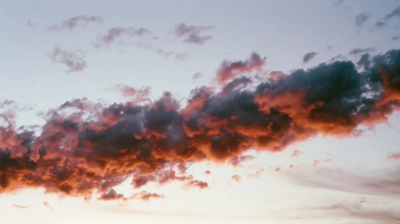 Dramatic cloud formation at sunset stretching across the sky
