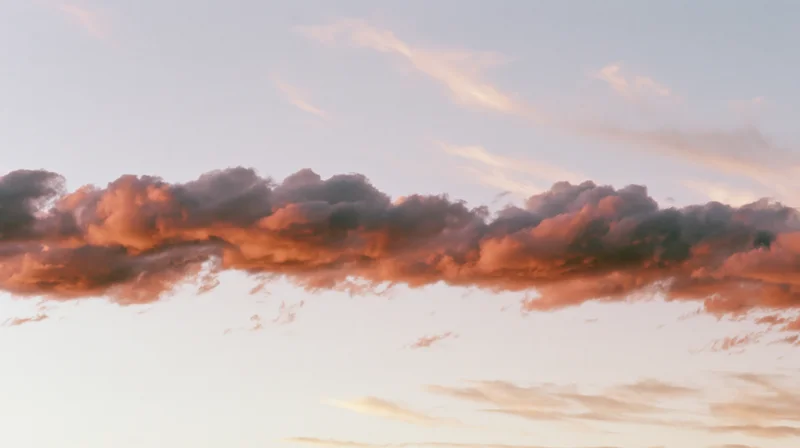 Dramatic cloud formation at sunset stretching across the sky