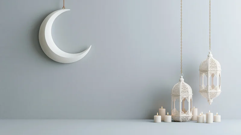White crescent moon and hanging lanterns with candles on a minimalist gray surface