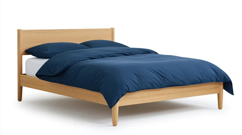 Minimalist wooden double bed with blue bedding and white mattress on plain background