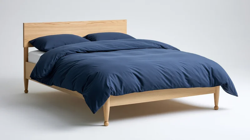 Minimalist wooden double bed with blue bedding on white background