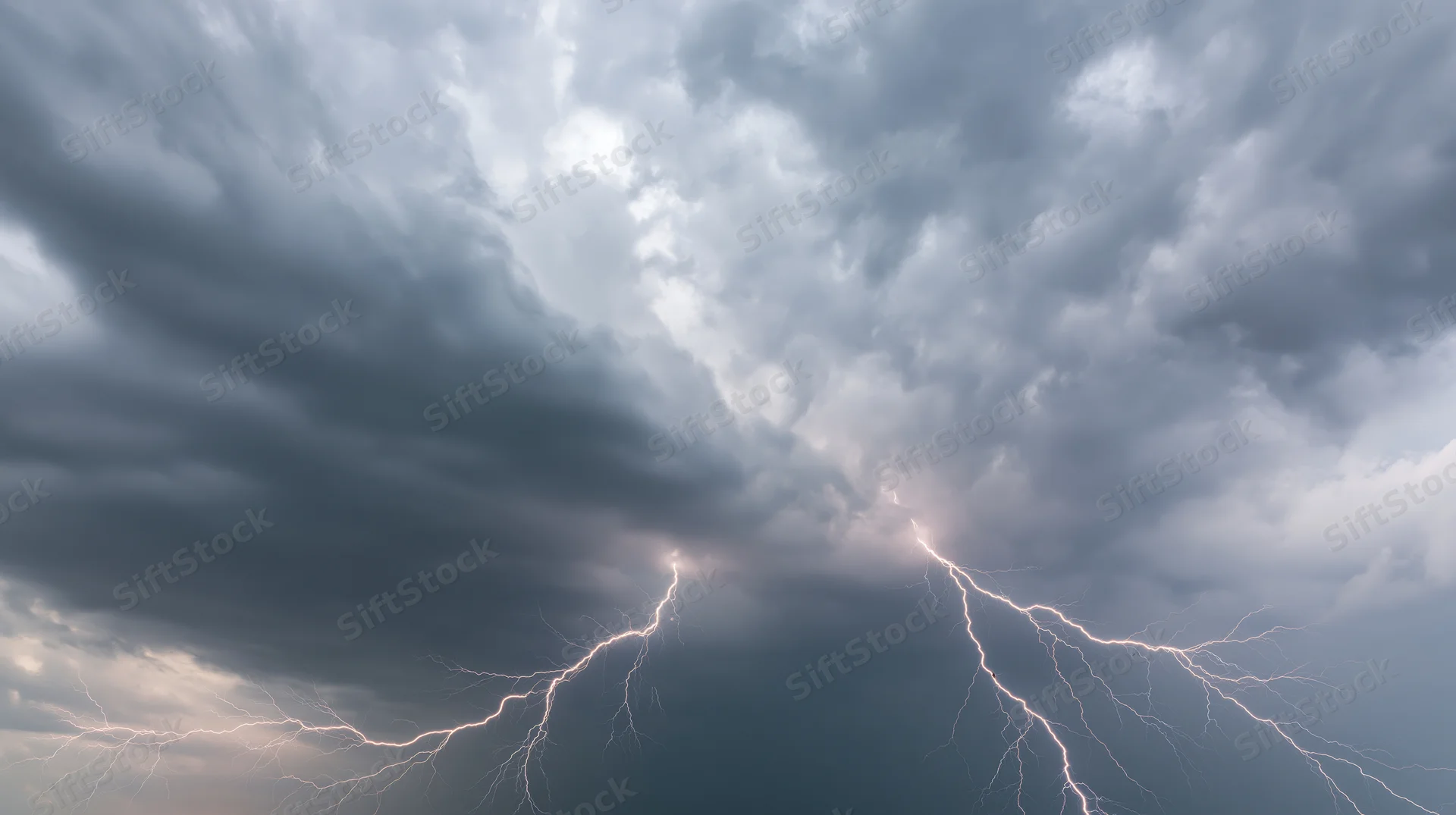 Lightning bolts branching across a turbulent storm sky