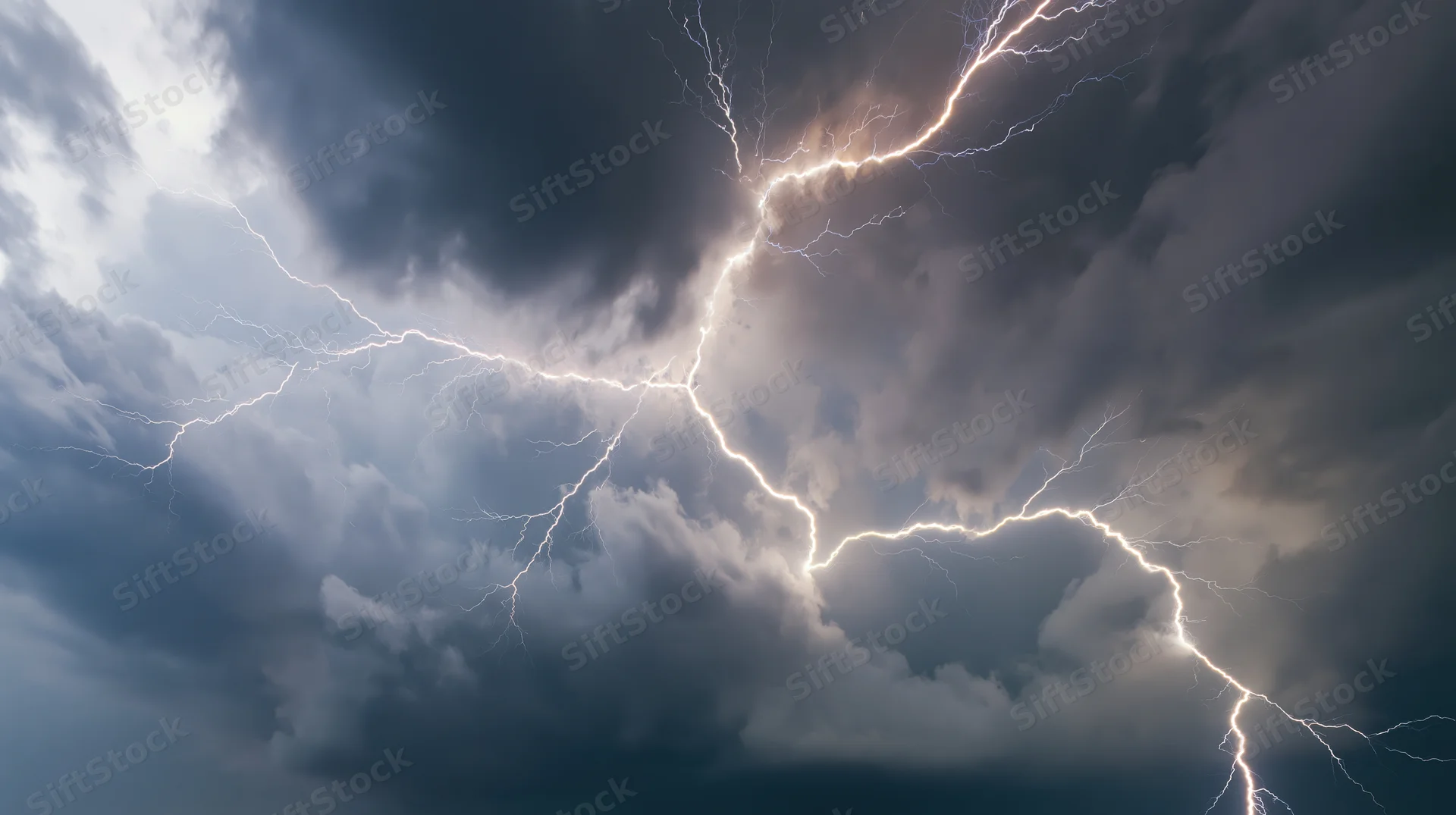 Lightning bolts branching across a turbulent storm sky