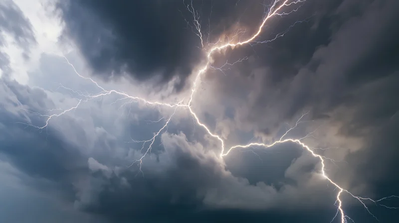 Lightning bolts branching across a turbulent storm sky