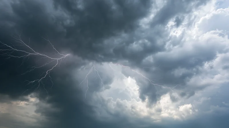 Lightning bolts branching across a turbulent storm sky