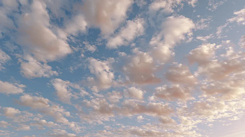 Open sky filled with scattered cumulus clouds during daytime