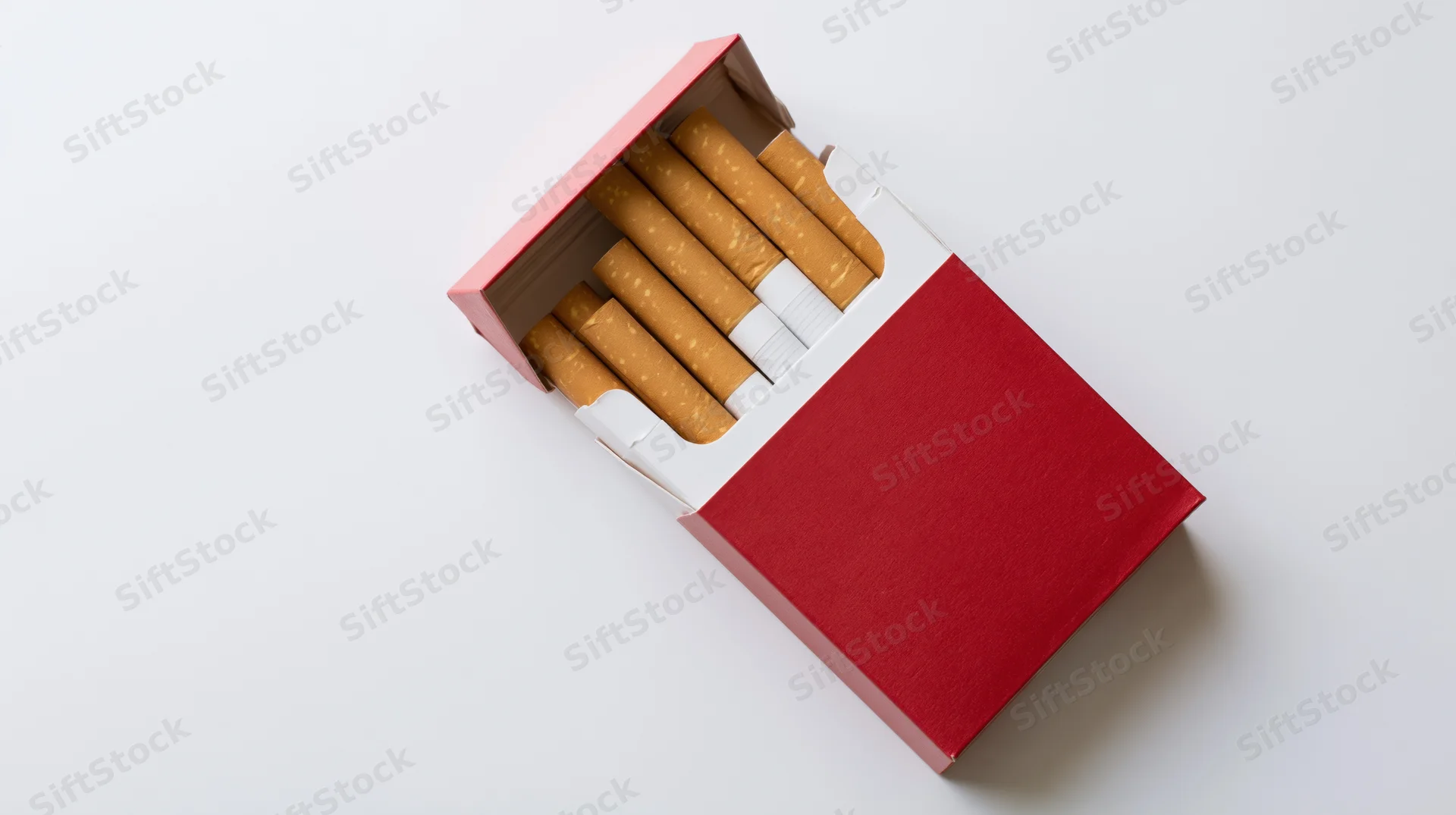 Open red and white cigarette pack with several cigarettes visible on white background
