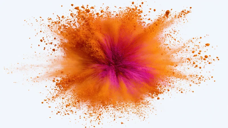 Orange and pink holi powder exploding outward from a central point on white background