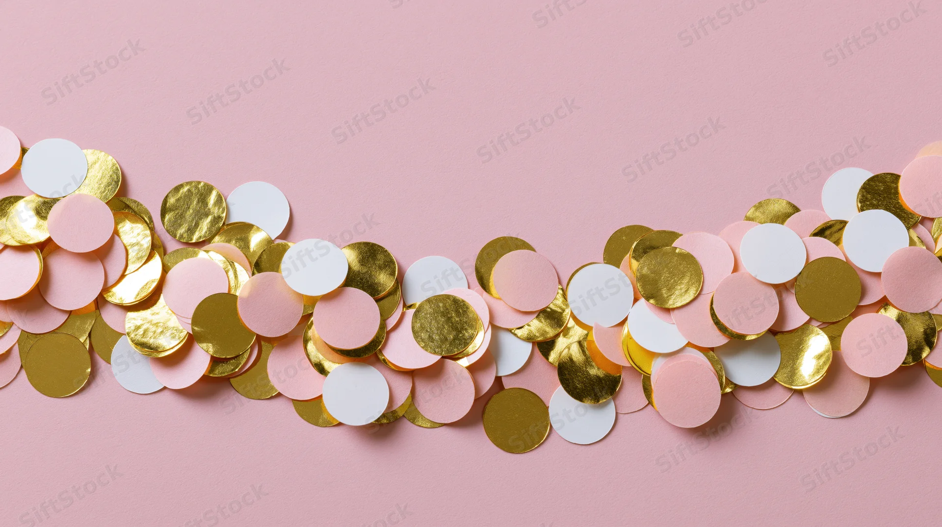 Scattered round confetti in gold, white and pale pink arranged in a border on a pink background