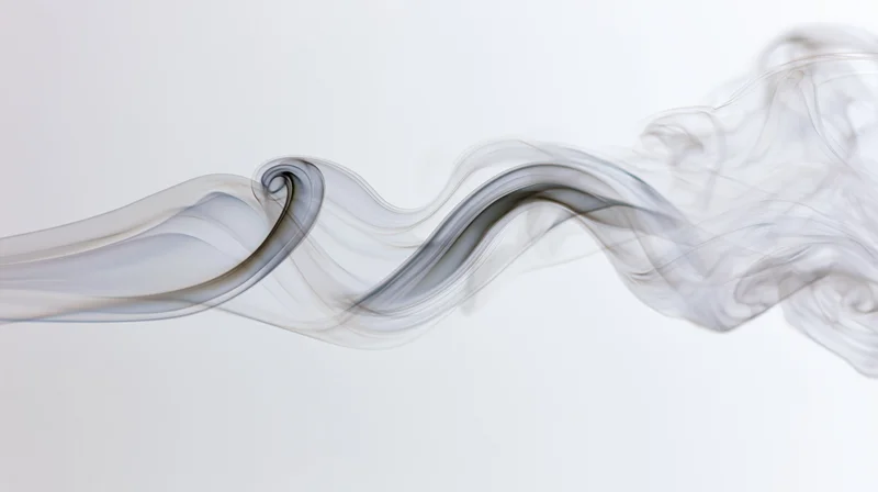Thin wisps of pale gray smoke drifting horizontally across a white background