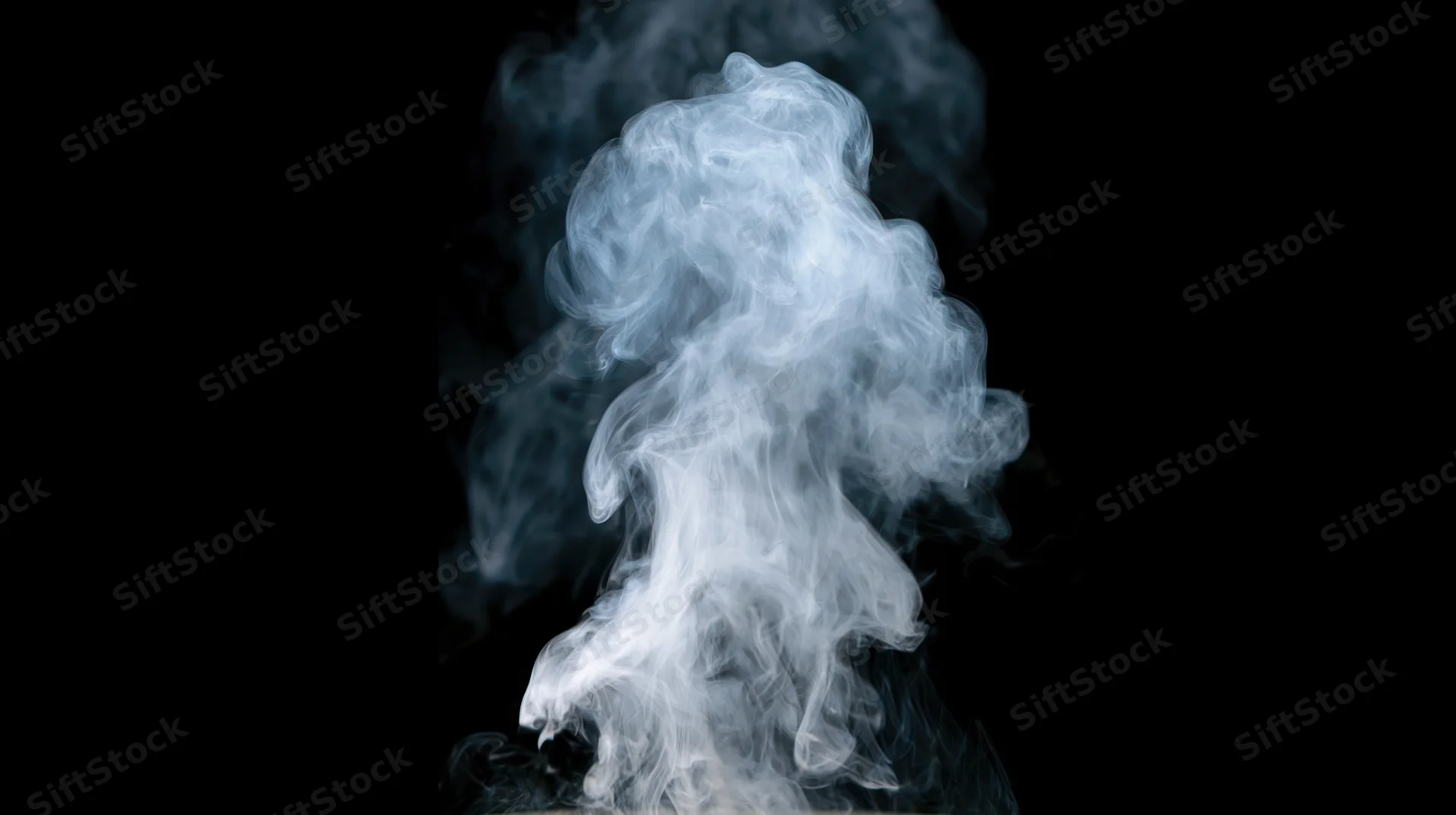 White-grey smoke rising and curling upward against a pure black background
