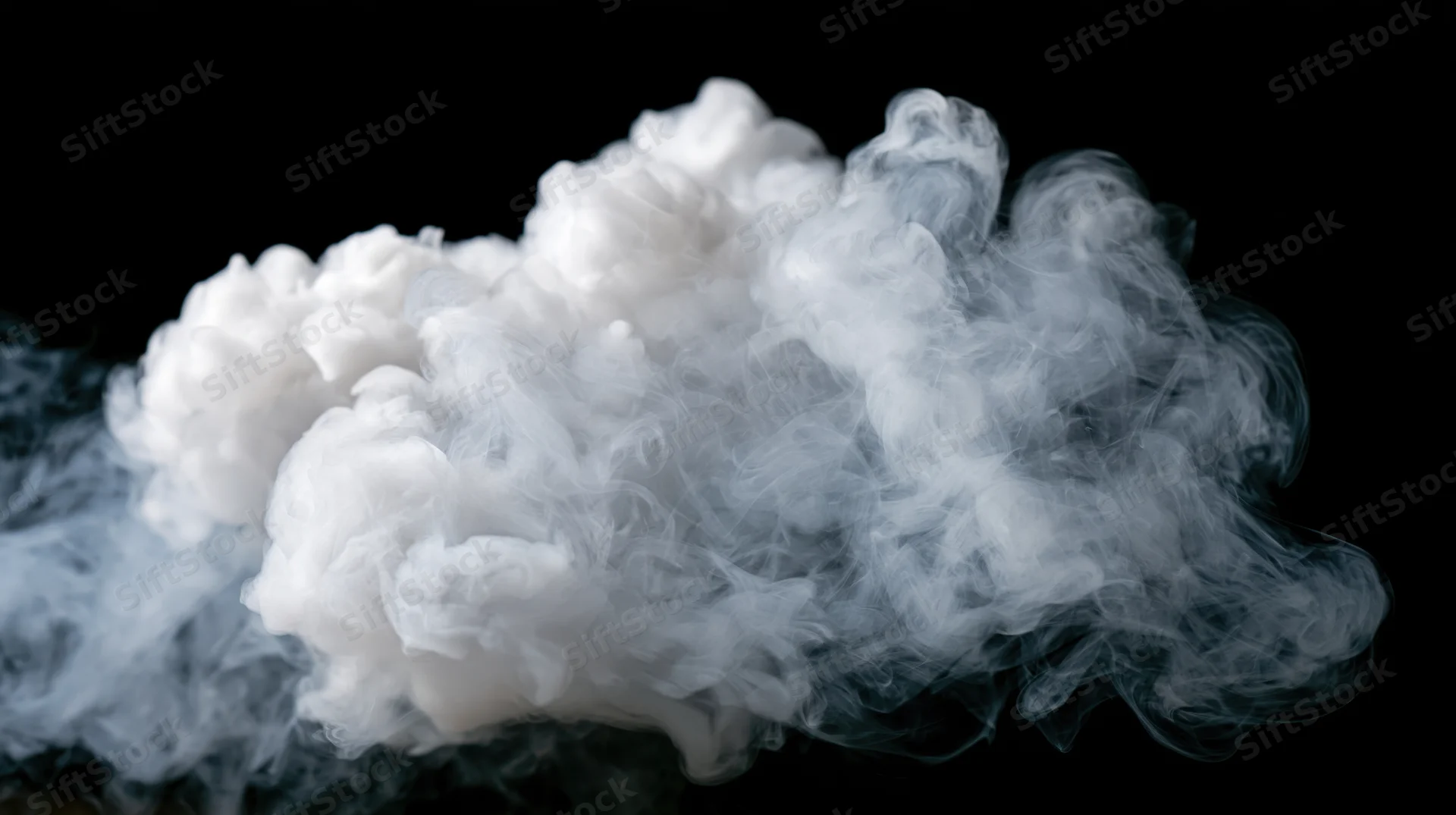 White smoke drifting and curling mid-air against a pure black background