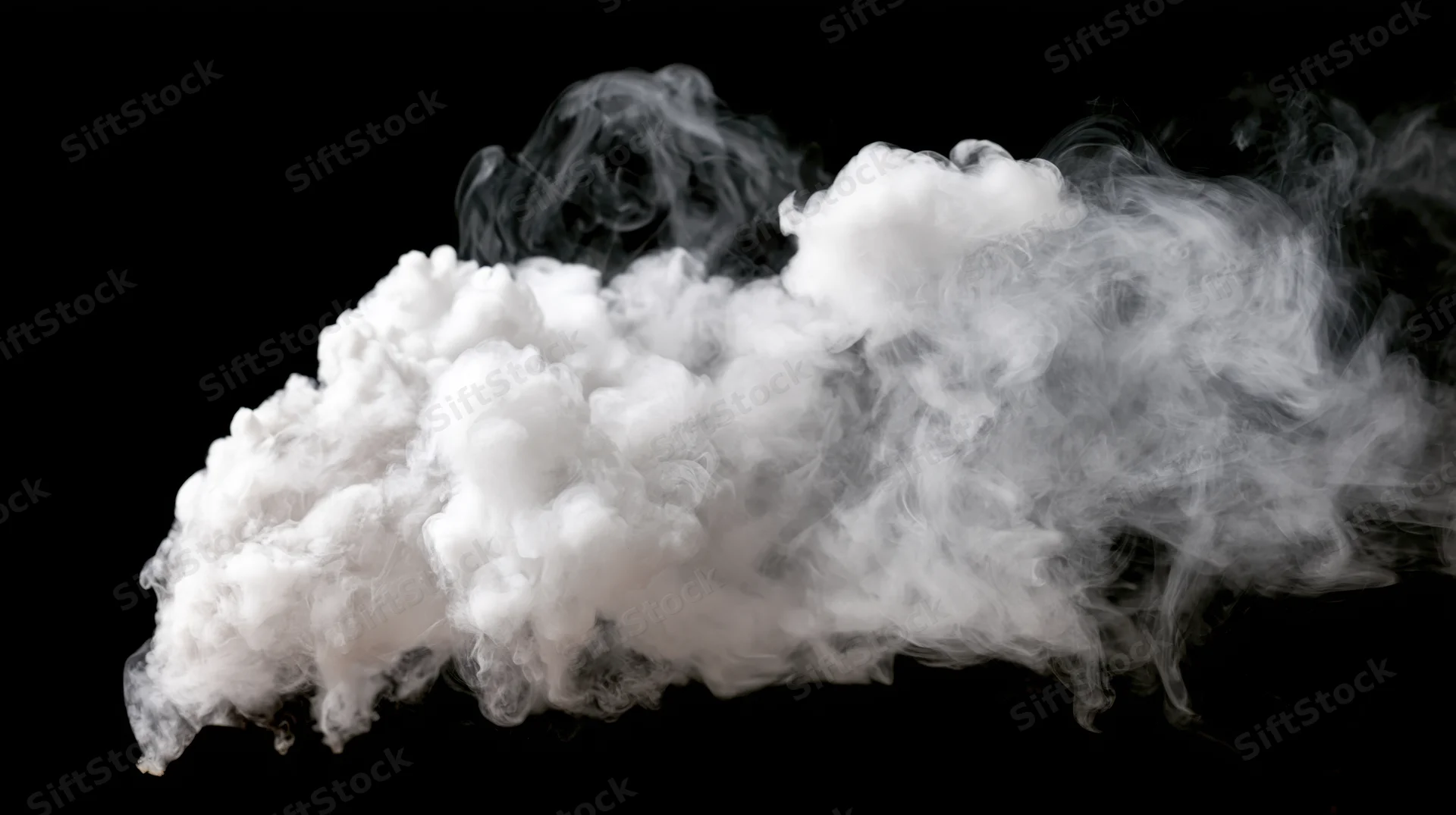 White smoke drifting and curling mid-air against a pure black background
