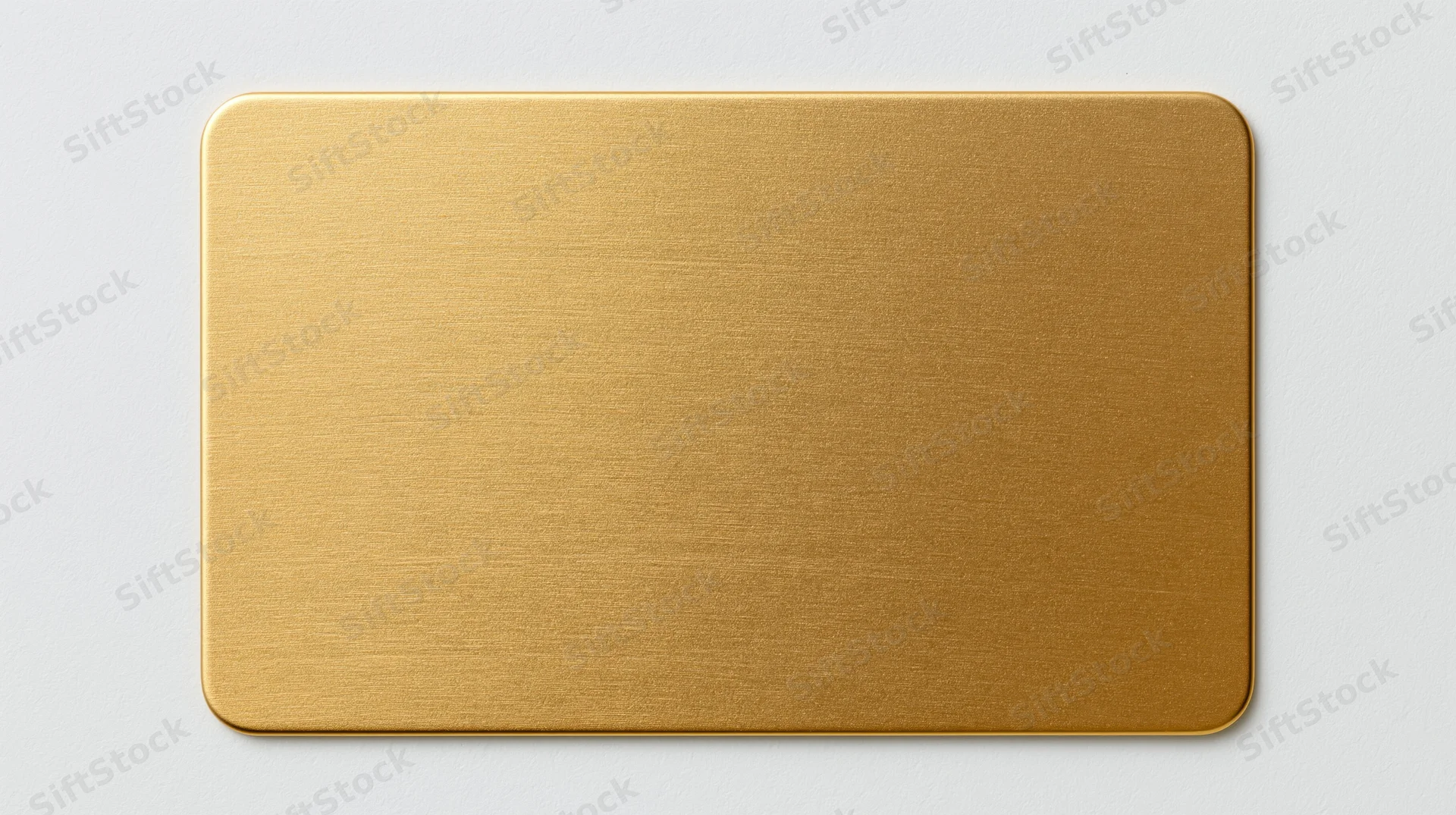 Blank gold metal business card lying flat centered on white background