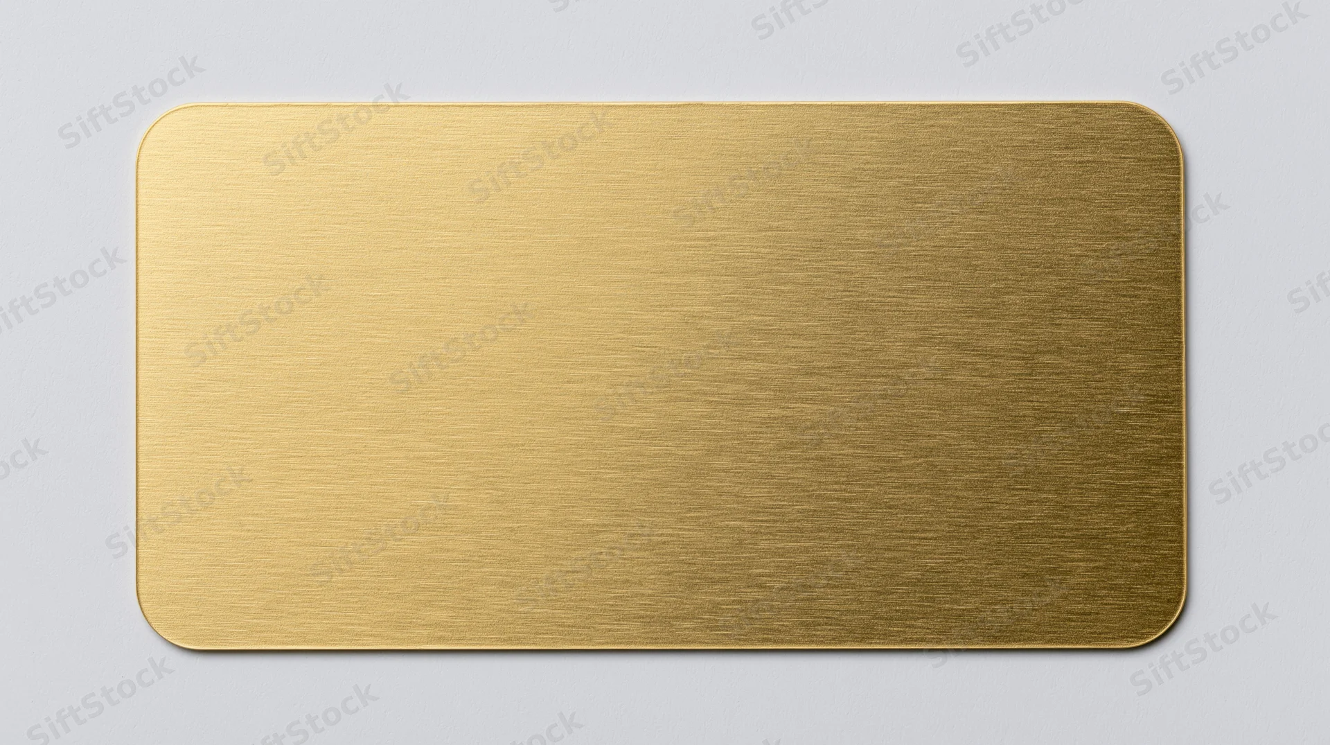 Blank gold metal business card lying flat centered on white background