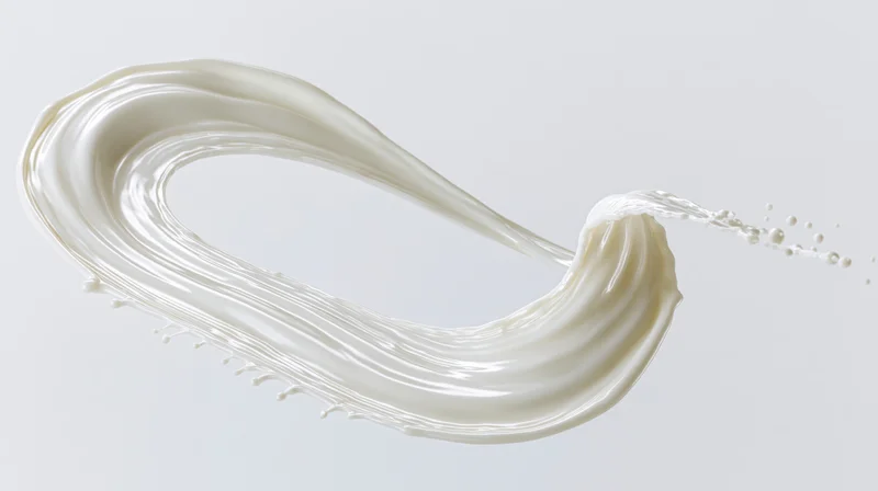 Curved ribbon of white milk mid-splash twisting in smooth motion against plain background