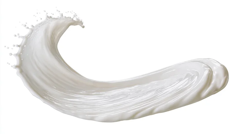Curved ribbon of white milk mid-splash twisting in smooth arc against white background