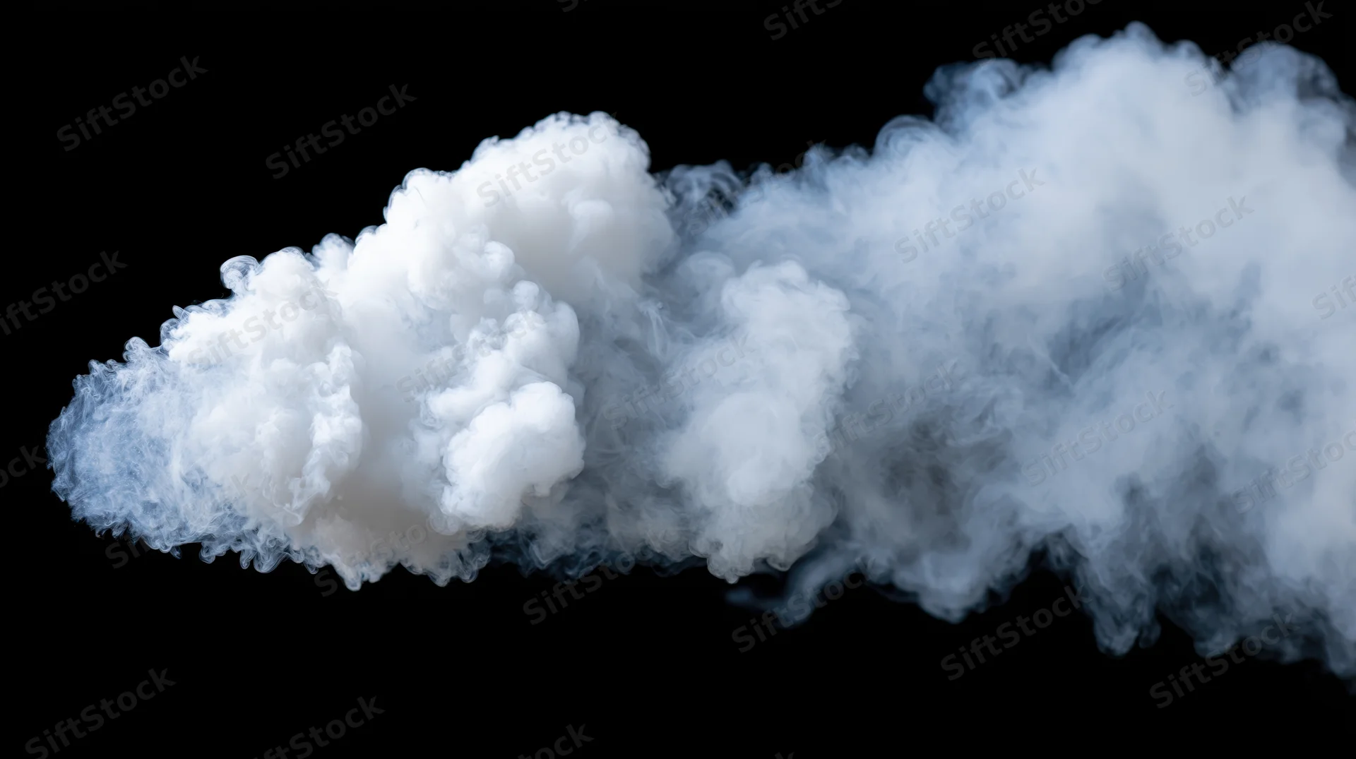 Dense horizontal plume of white smoke billowing and dispersing against black background