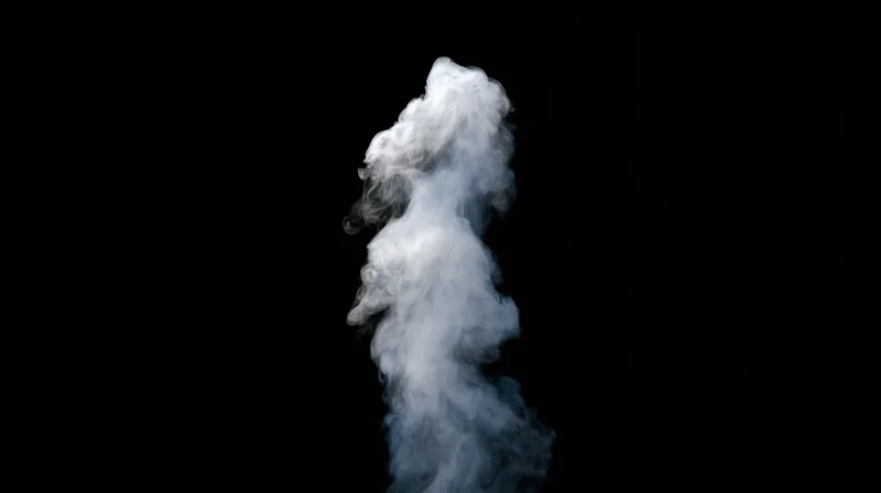 Rising plume of white smoke drifting upward against black background