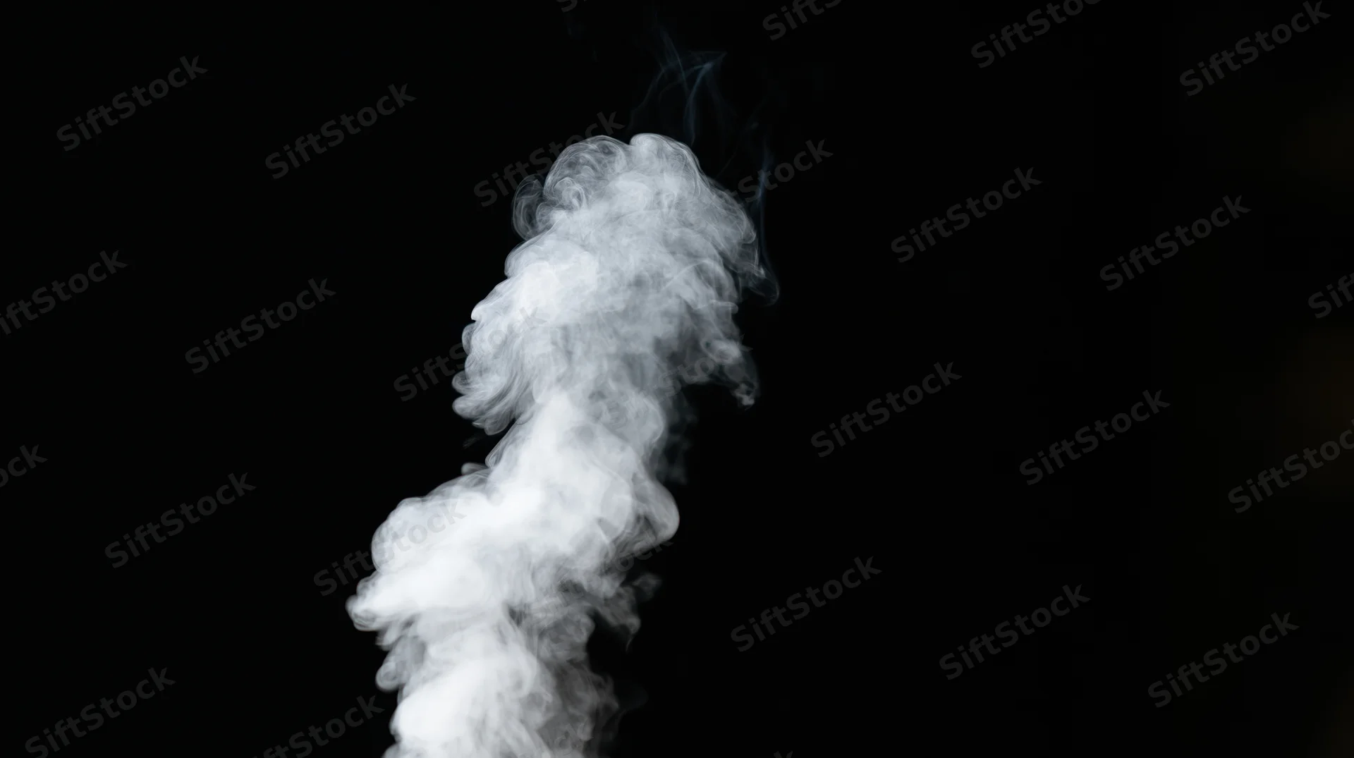 Rising plume of white smoke drifting upward against black background