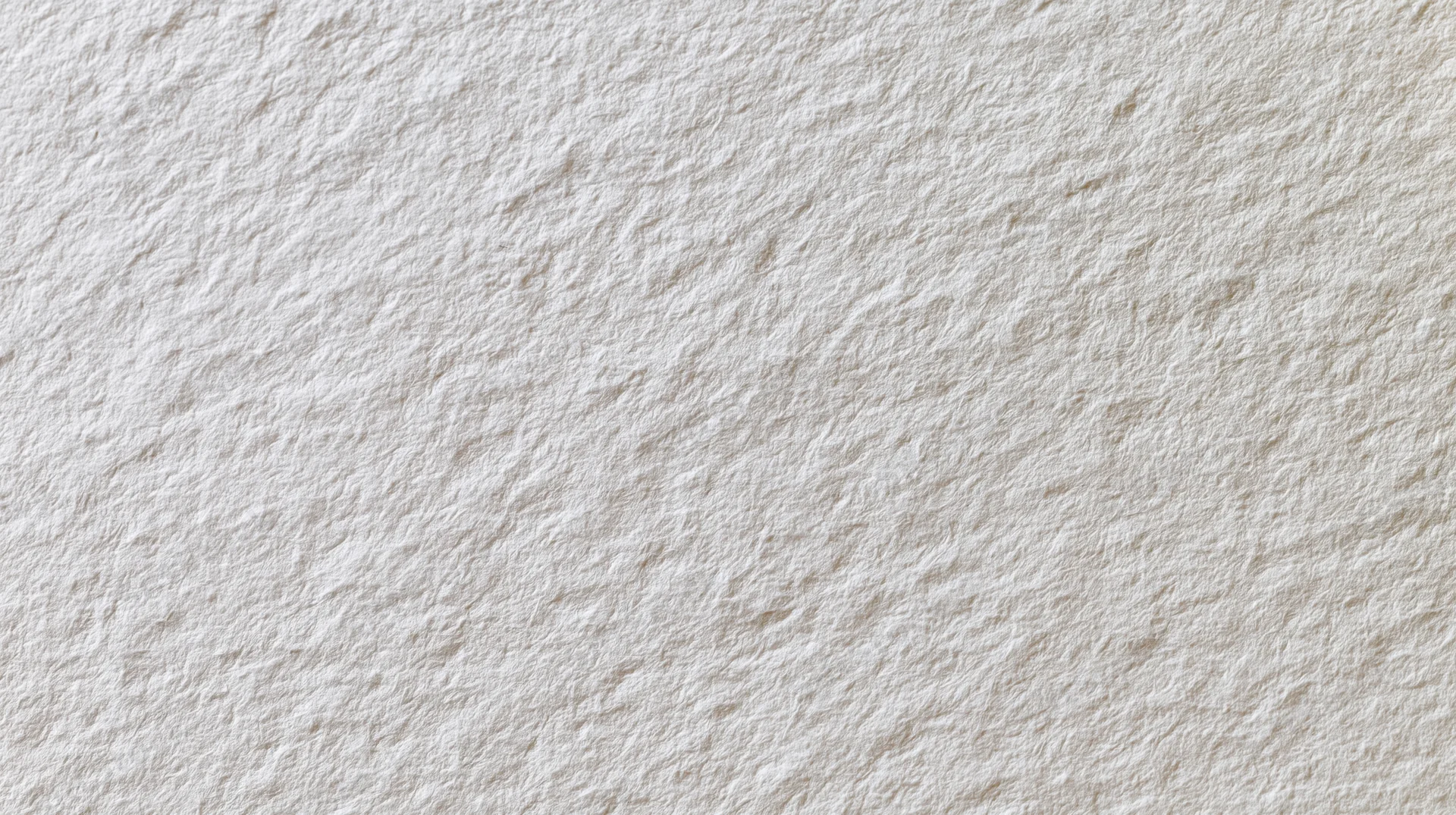 Close-up of a plain white paper sheet with textured surface filling the frame