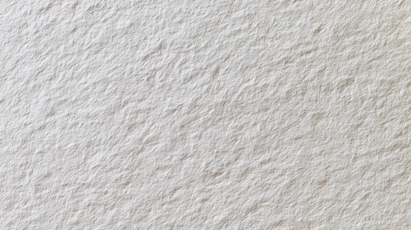 Close-up of a plain white paper sheet with textured surface filling the frame