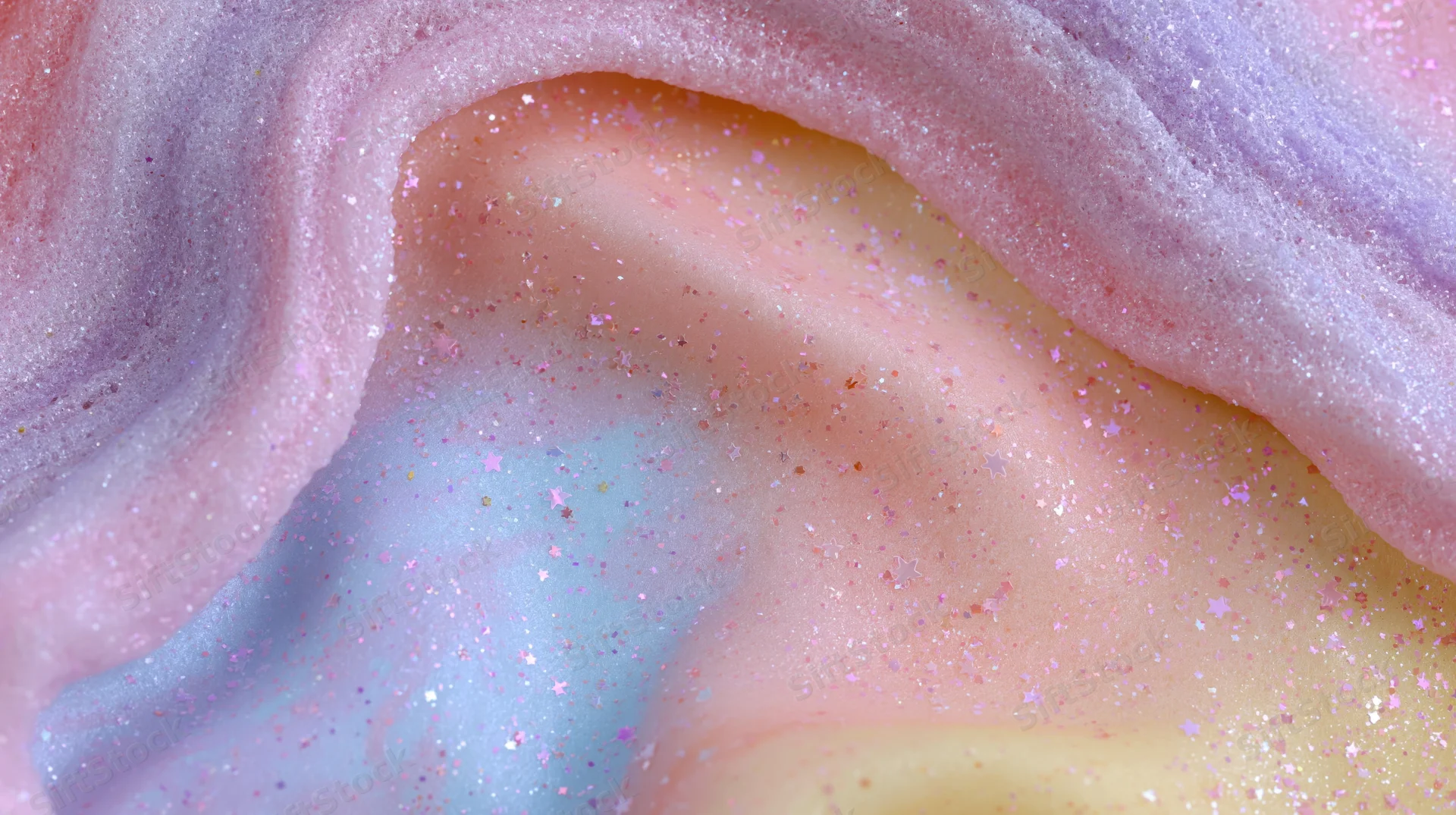 Wavy pastel layers with glitter forming a soft abstract background