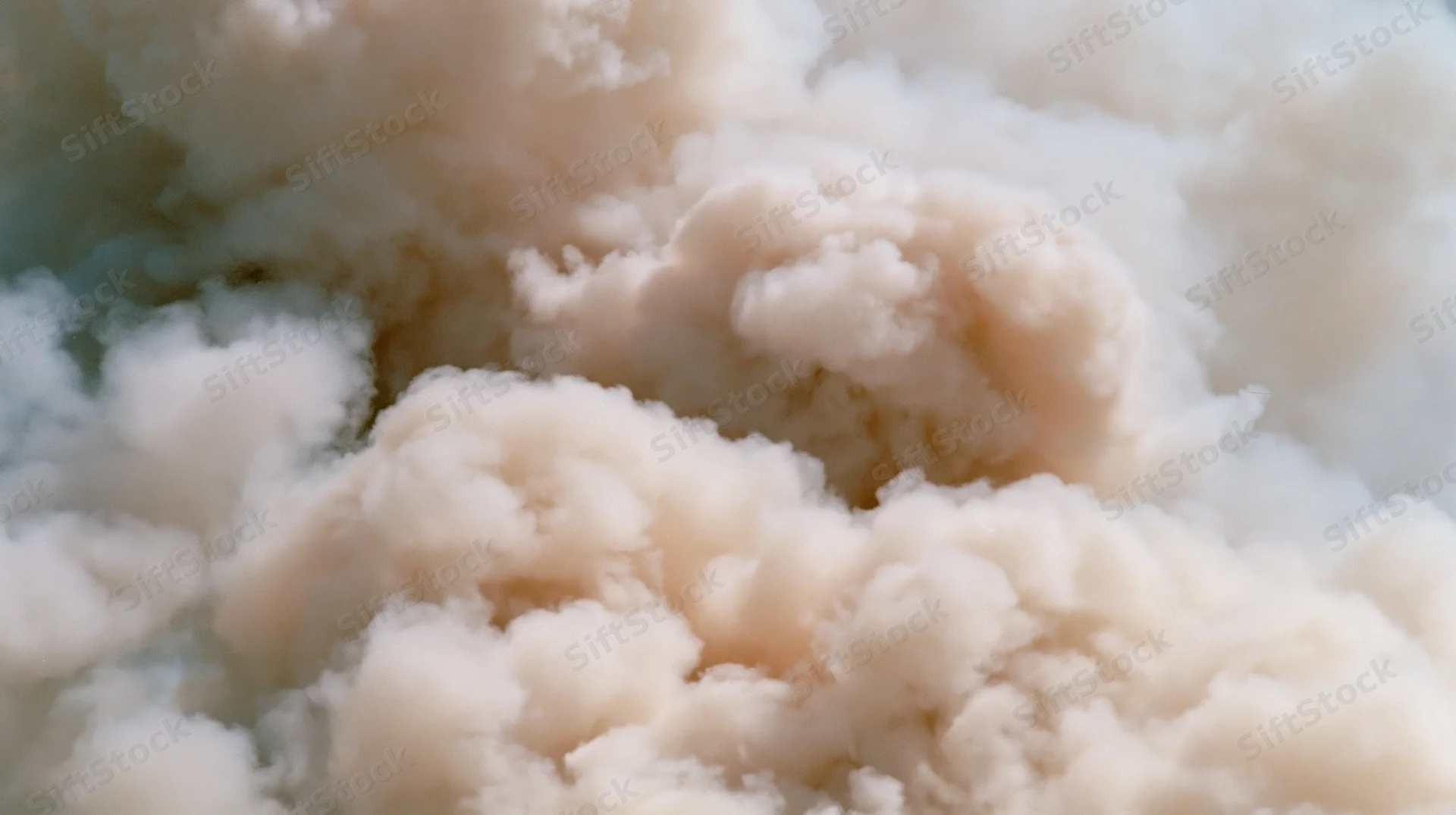 Dense billowing white smoke filling the frame with soft swirling texture