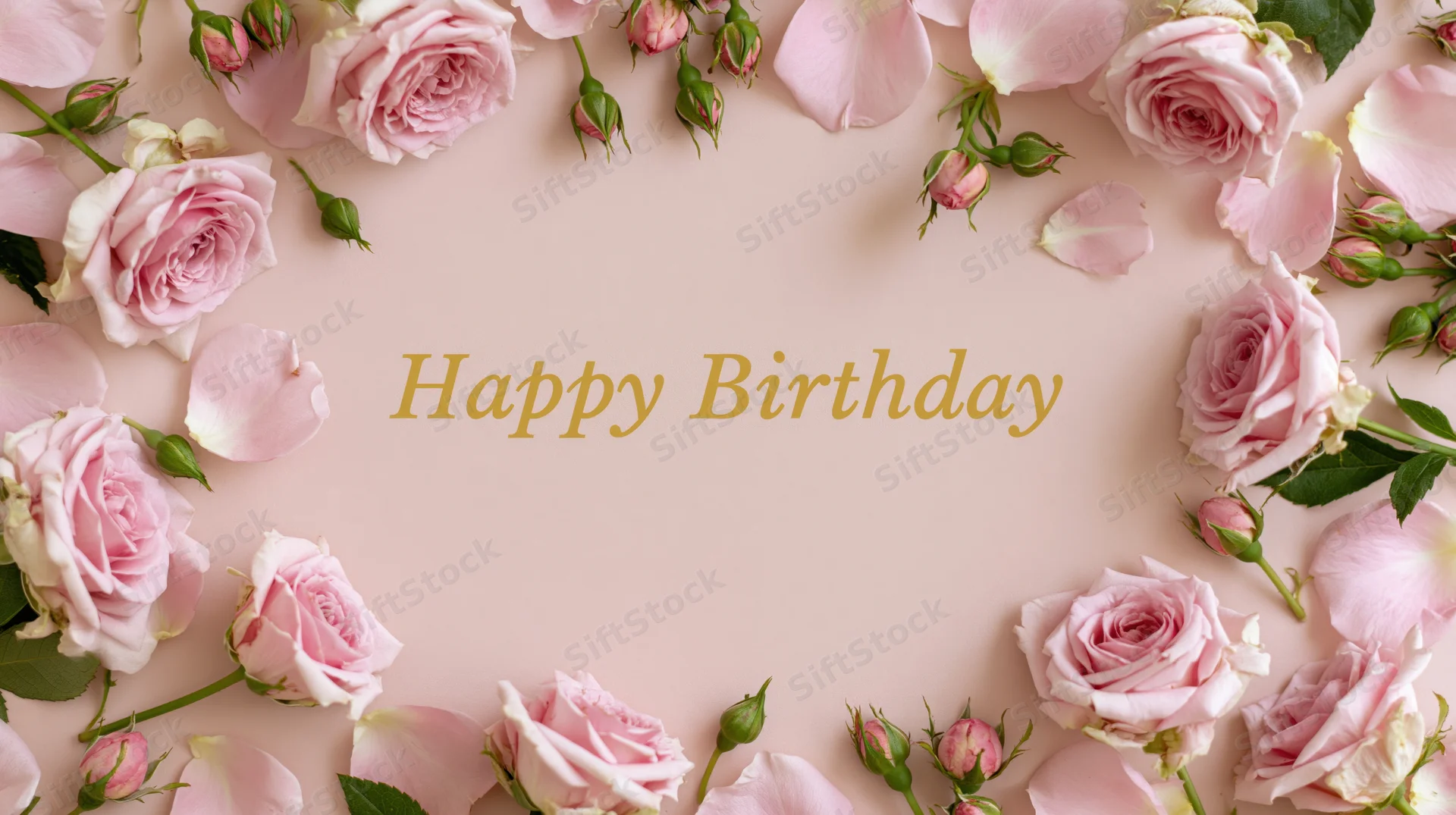 Pink roses and petals arranged in a frame around gold text reading happy birthday on a soft pink background