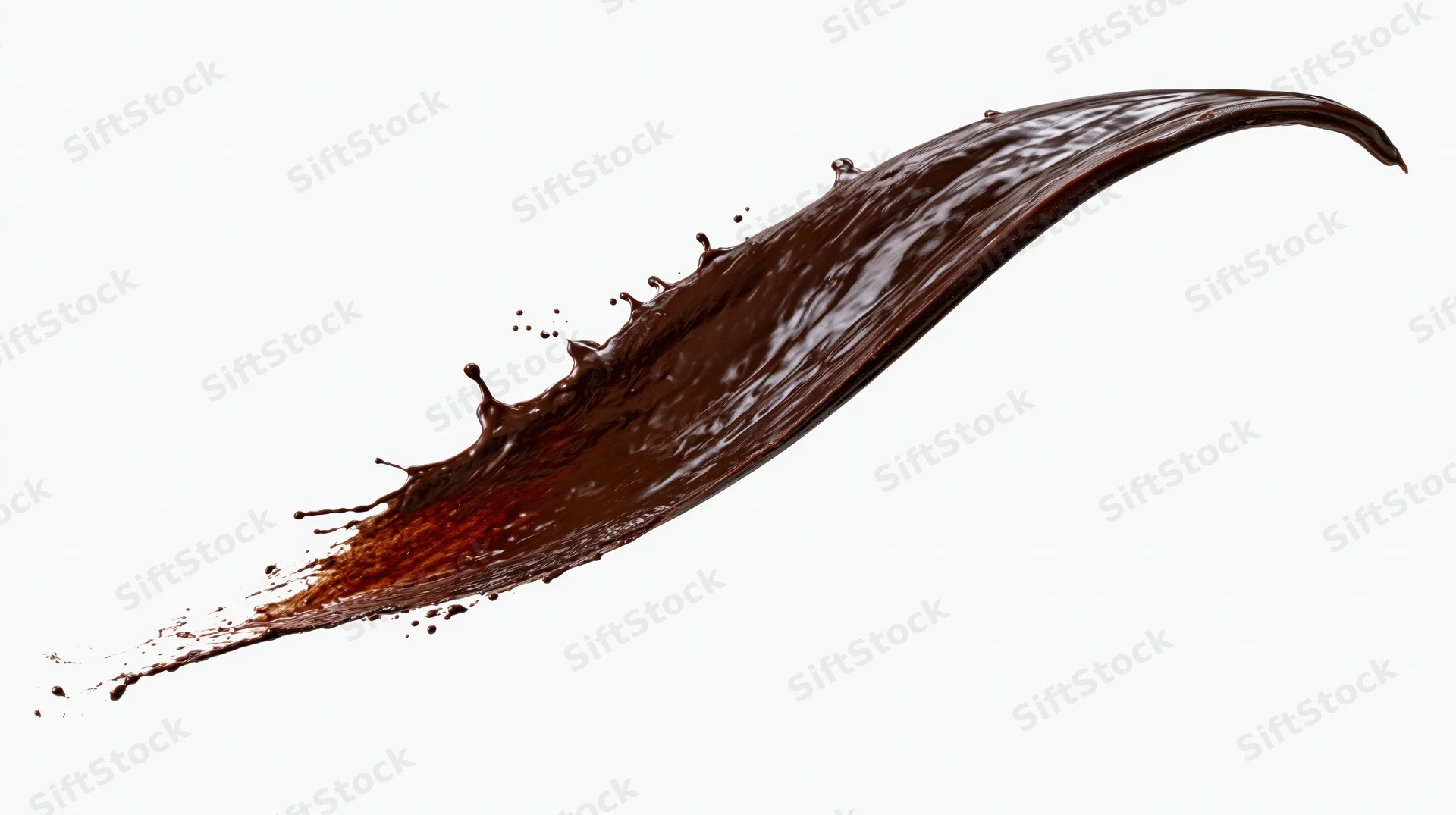 Dark chocolate liquid splashing in dynamic arc frozen in motion against white background