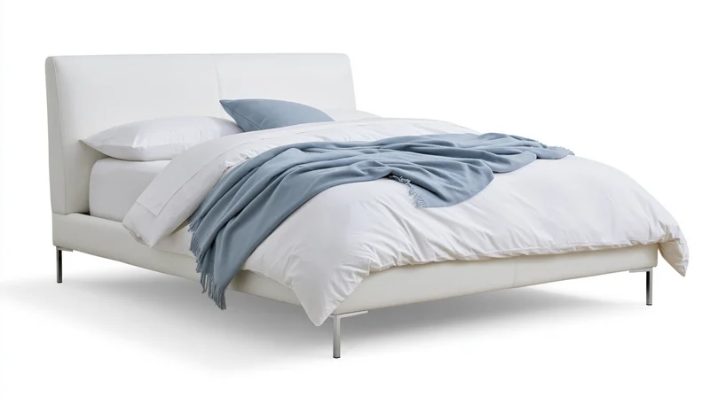 Modern double bed with white upholstered frame and chrome legs, dressed with white bedding and blue blanket, isolated on white background