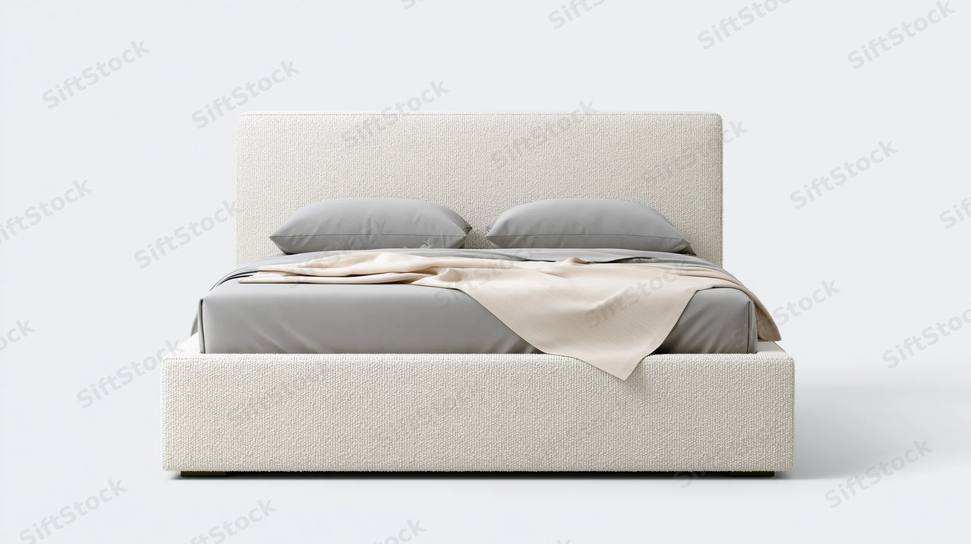 Modern upholstered platform bed with gray bedding and beige throw blanket, photographed straight-on against white background