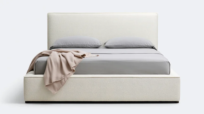 Modern upholstered platform bed with tall square headboard and gray bedding on white background