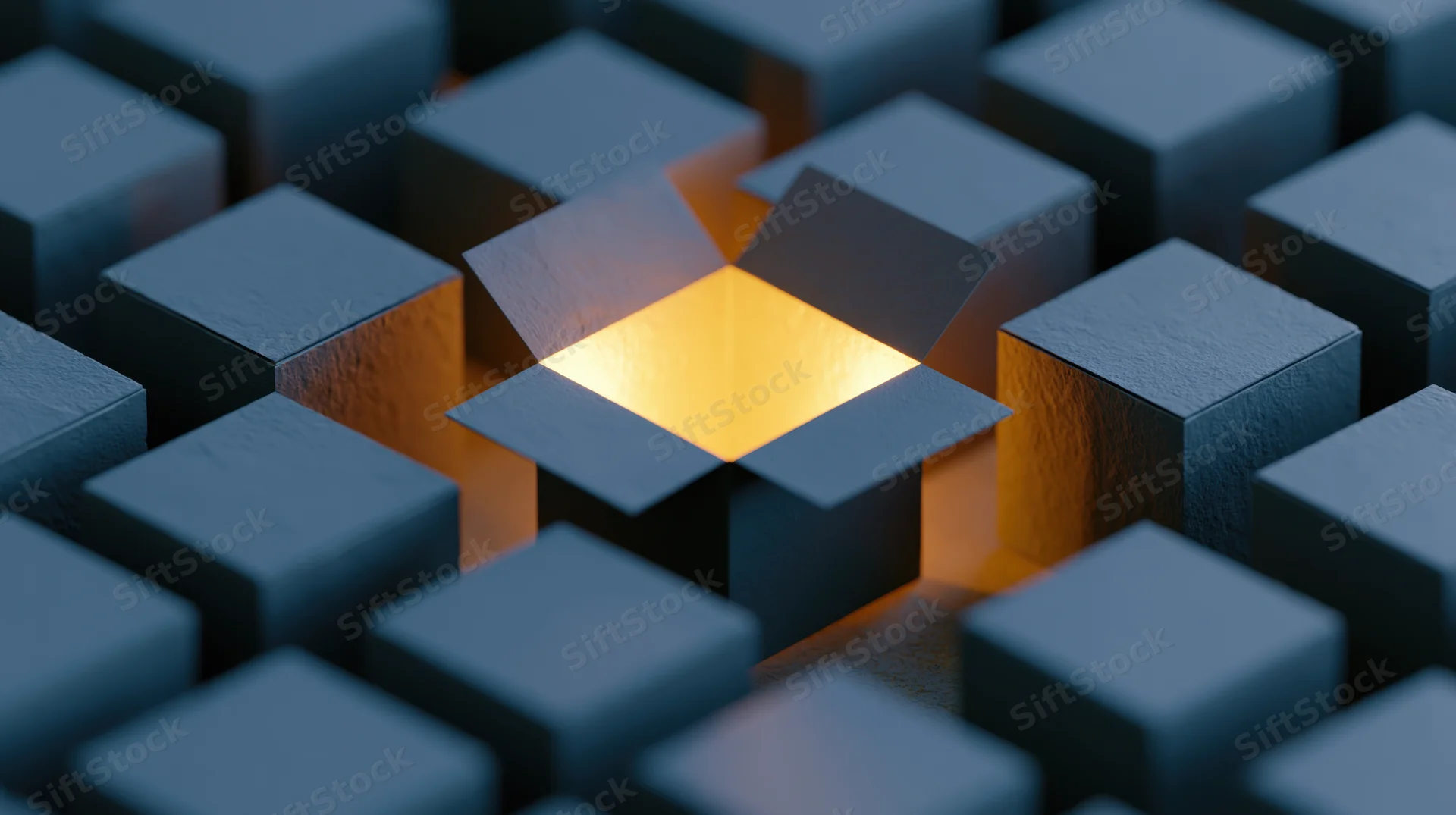 Open cardboard box glowing with warm yellow light in a grid of dark cubes