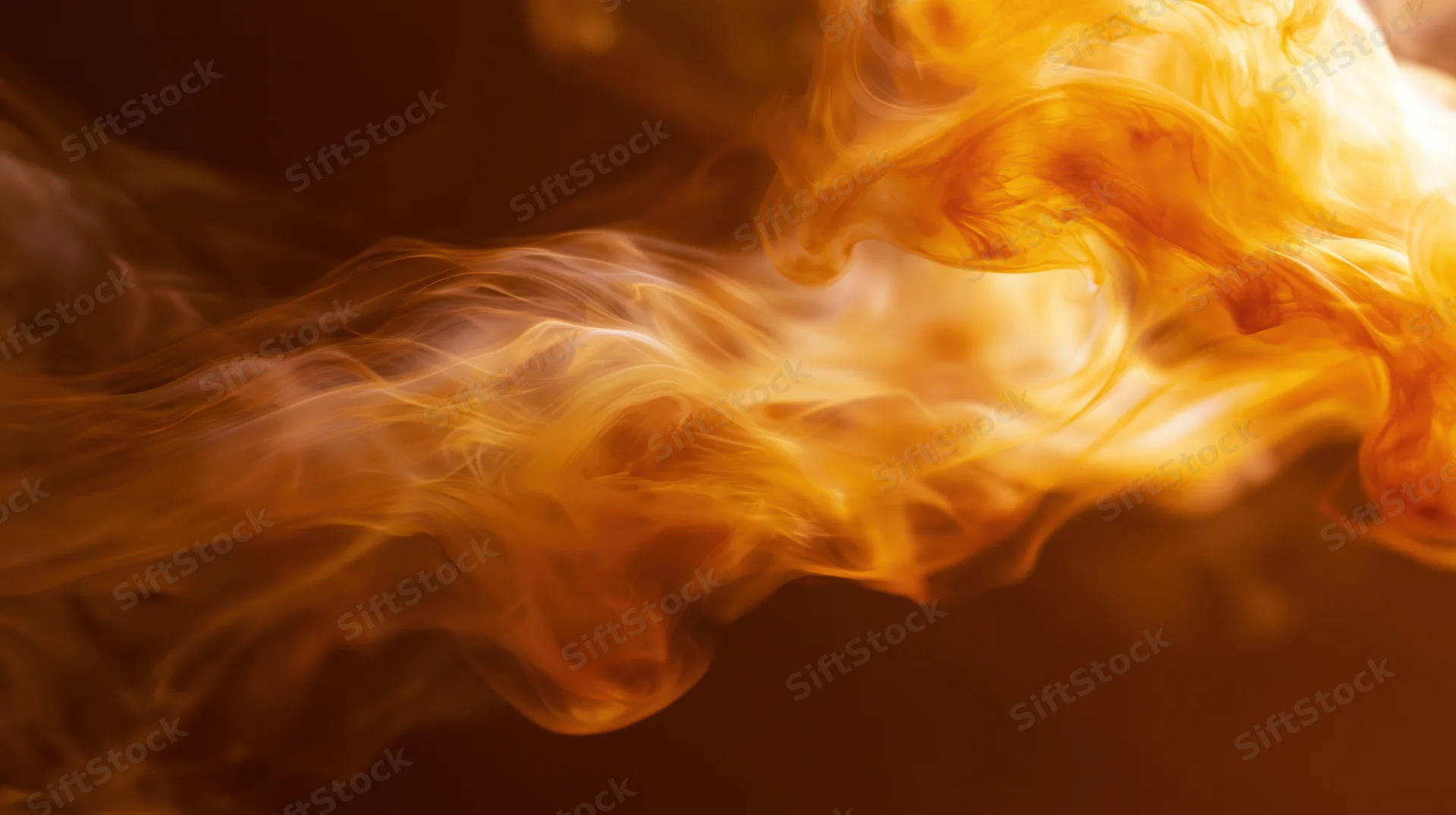 Swirling orange and amber smoke wisps against a dark background