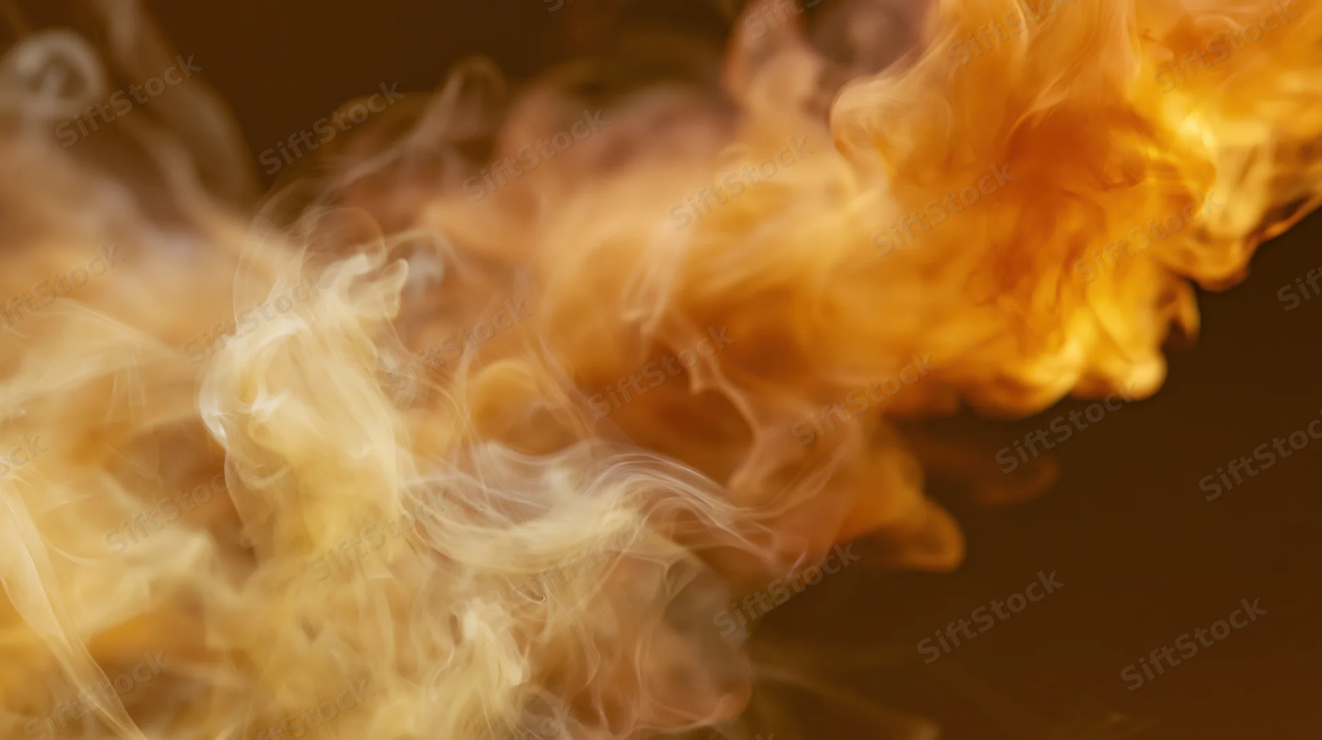 Swirling orange and amber smoke wisps rising against a dark background